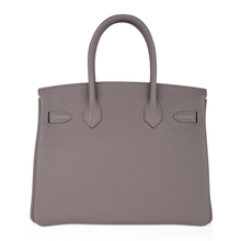 Load image into Gallery viewer, Sophisticated Muted Greige Pebble Grain Medium Structured Trapezoid Tote With Sleek Silvery Twist Lock Hardware And Hanging Decorative Metal Padlock Charm