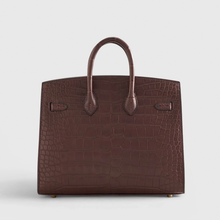 Load image into Gallery viewer, Rich Matte Hazelnut Brown Segmented Scaled Compact Sharp Edged Trapezoid Tote With Polished Warm Golden Twist Lock Hardware And Suspended Textured Metal Padlock Charm Crocodile Grain